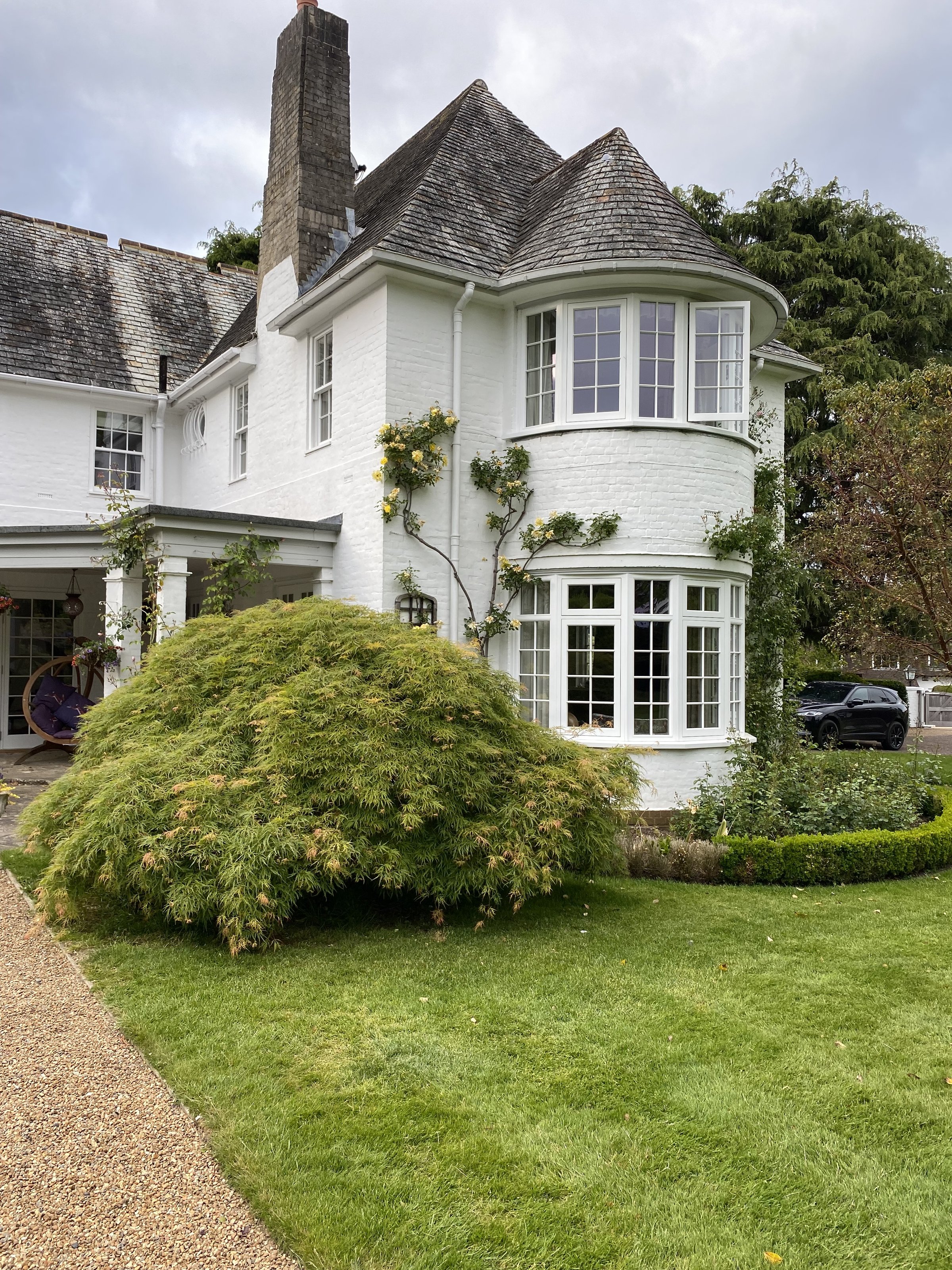 Exterior wall of a period property finished in a clean white coating