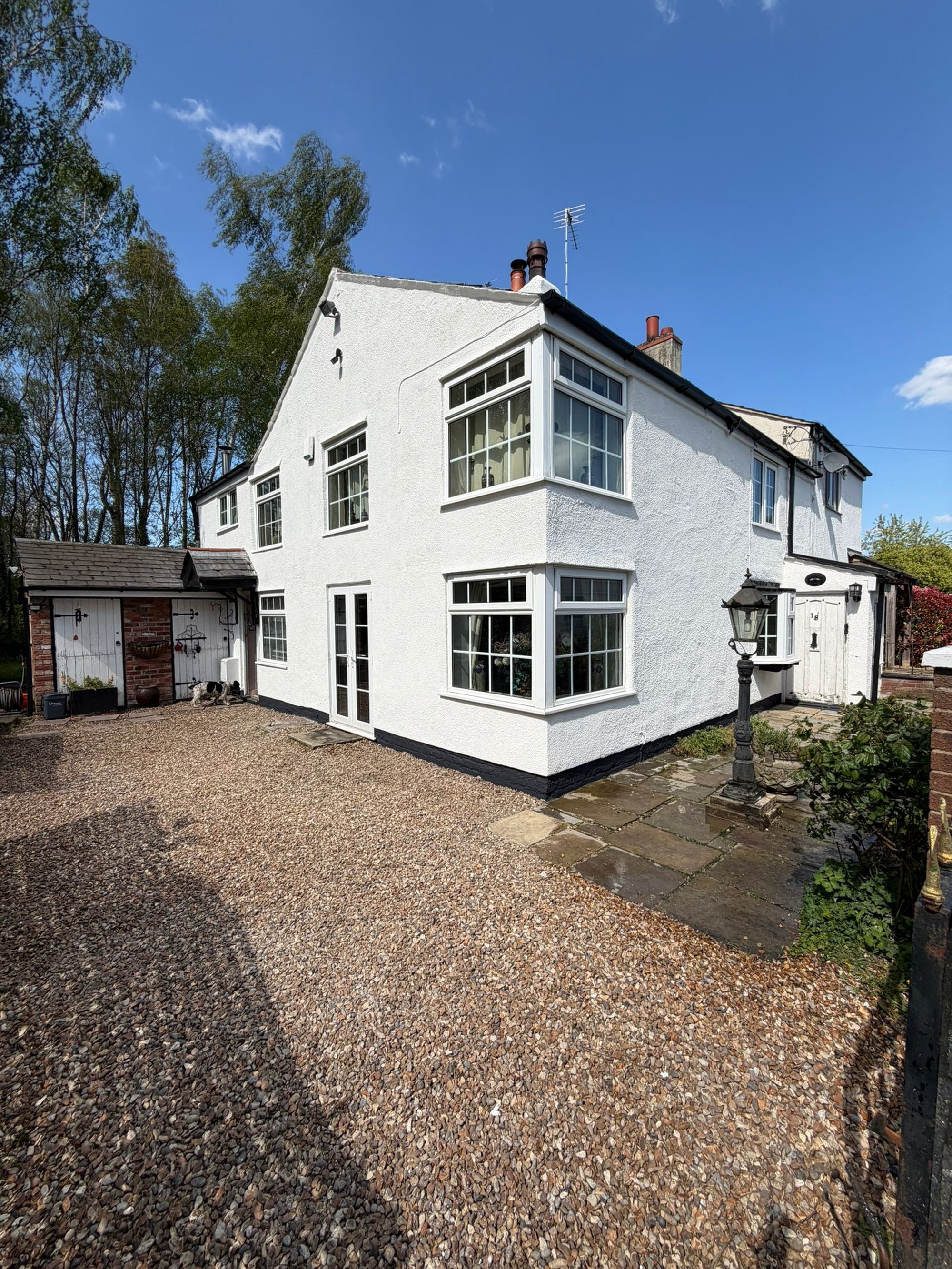 Medium-sized detached property with a smooth rendered exterior wall finish